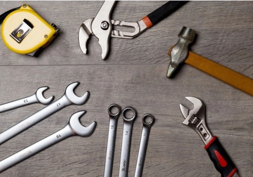 Bi-material molded handle for comfort and grip